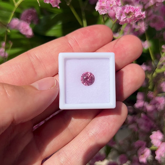 Video showing the intense brilliance, neon vivid pink flashes, and fiery round-cut sparkle of the unheated 1.75ct Vietnam spinel in motion.