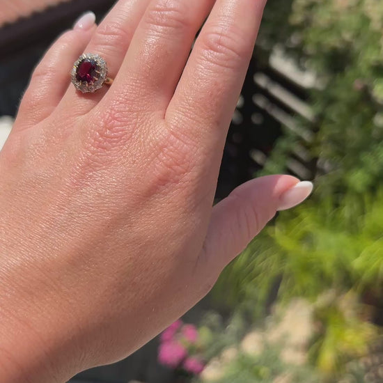 High-definition video capturing the rich raspberry-red flashes of the 2.5-carat rubellite garnet, the fiery brilliance of the 1-carat old-cut diamonds, and the detailed 18k gold craftsmanship of the circa 1890 Belle Époque ring in motion.