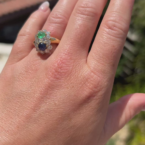 High-definition video capturing the smooth, luminous glow of the emerald and sapphire cabochons, the fiery brilliance of the accent diamonds, and the bold, sculptural 18k gold design of the vintage 1960s You and Me ring in motion.