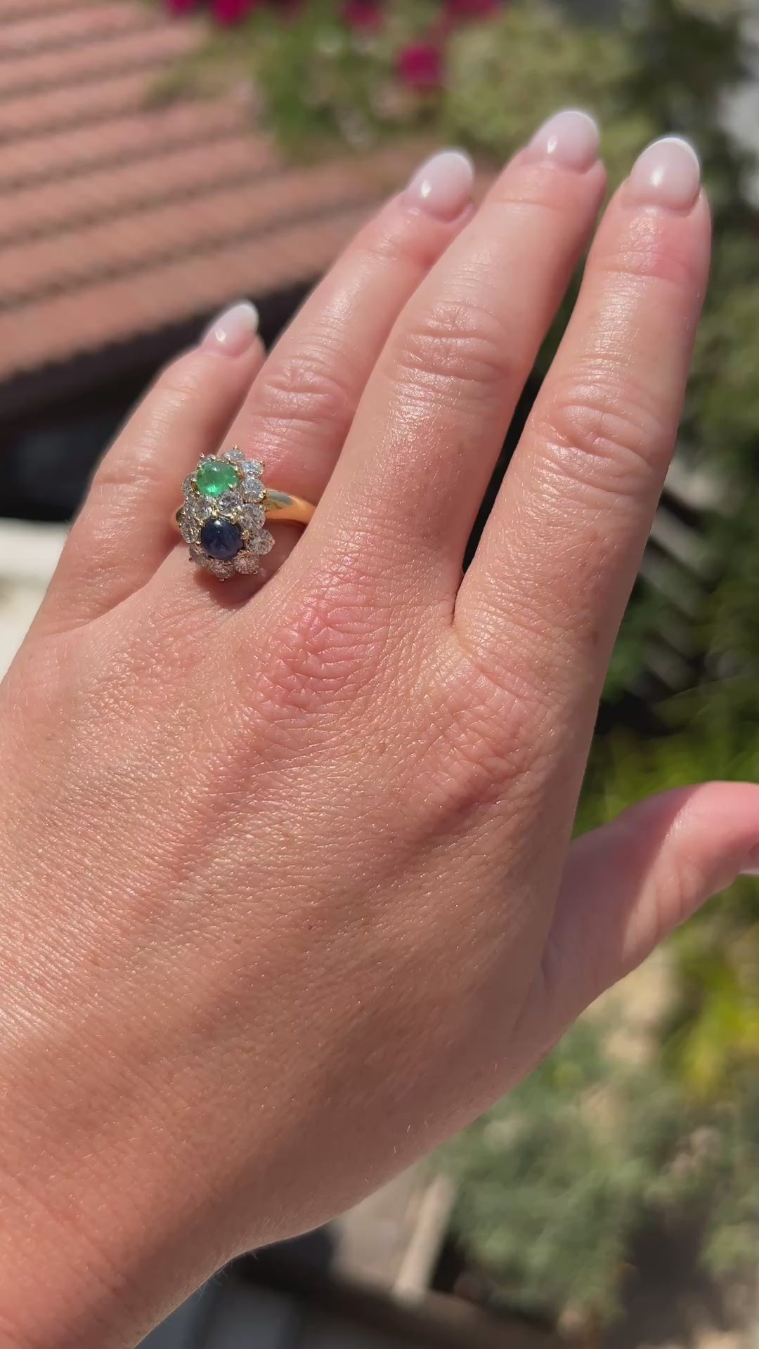 High-definition video capturing the smooth, luminous glow of the emerald and sapphire cabochons, the fiery brilliance of the accent diamonds, and the bold, sculptural 18k gold design of the vintage 1960s You and Me ring in motion.