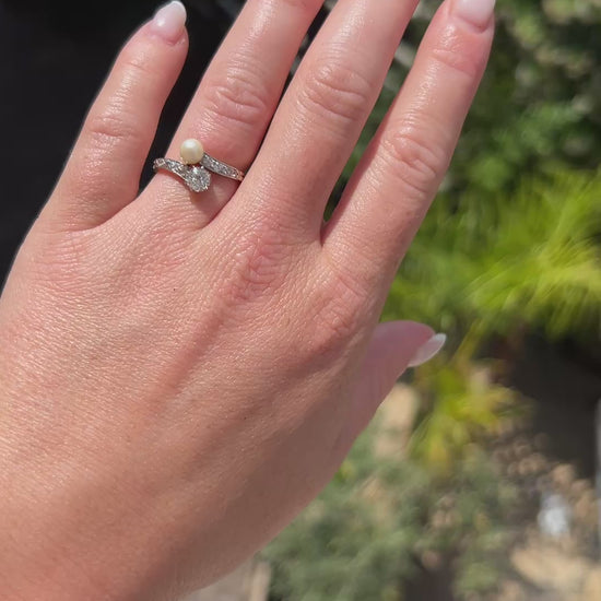 High-definition video capturing the fiery brilliance of the old-cut diamond, the soft iridescent glow of the natural pearl, and the elegant, romantic curvature of the circa 1900 Belle Époque 18k gold and platinum ring in motion.