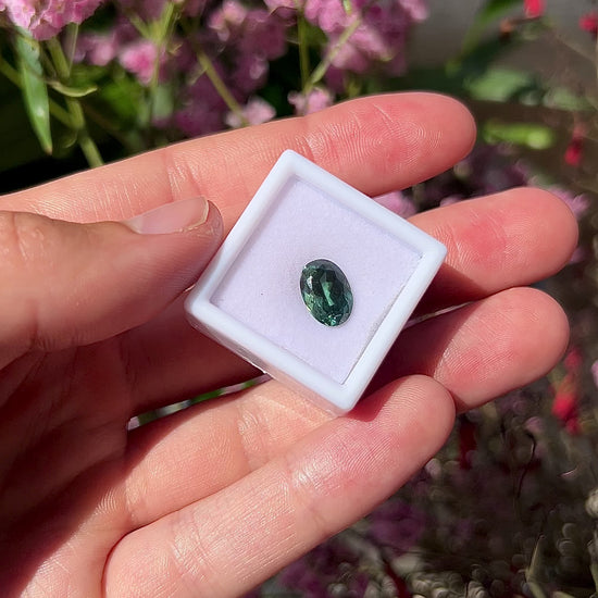 Video showing the intense luster, unique forest green flashes, and beautiful lively sparkle of the unheated 3.55ct oval green sapphire in motion.