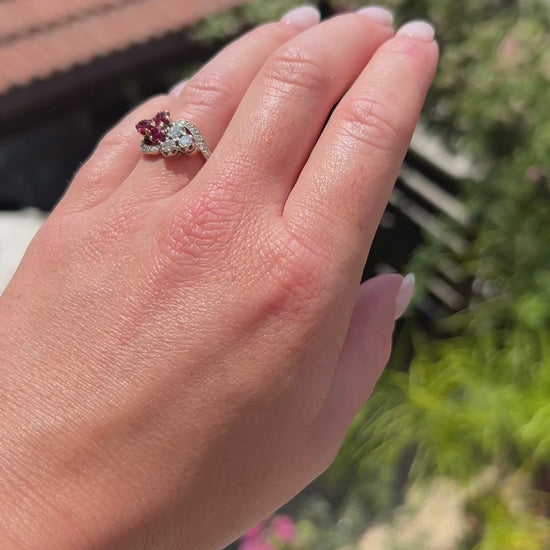 High-definition video capturing the rich crimson red glow of the ruby, the fiery brilliance of the old-cut diamonds, and the romantic clover shape of the antique Belle Époque Toi et Moi ring in motion.