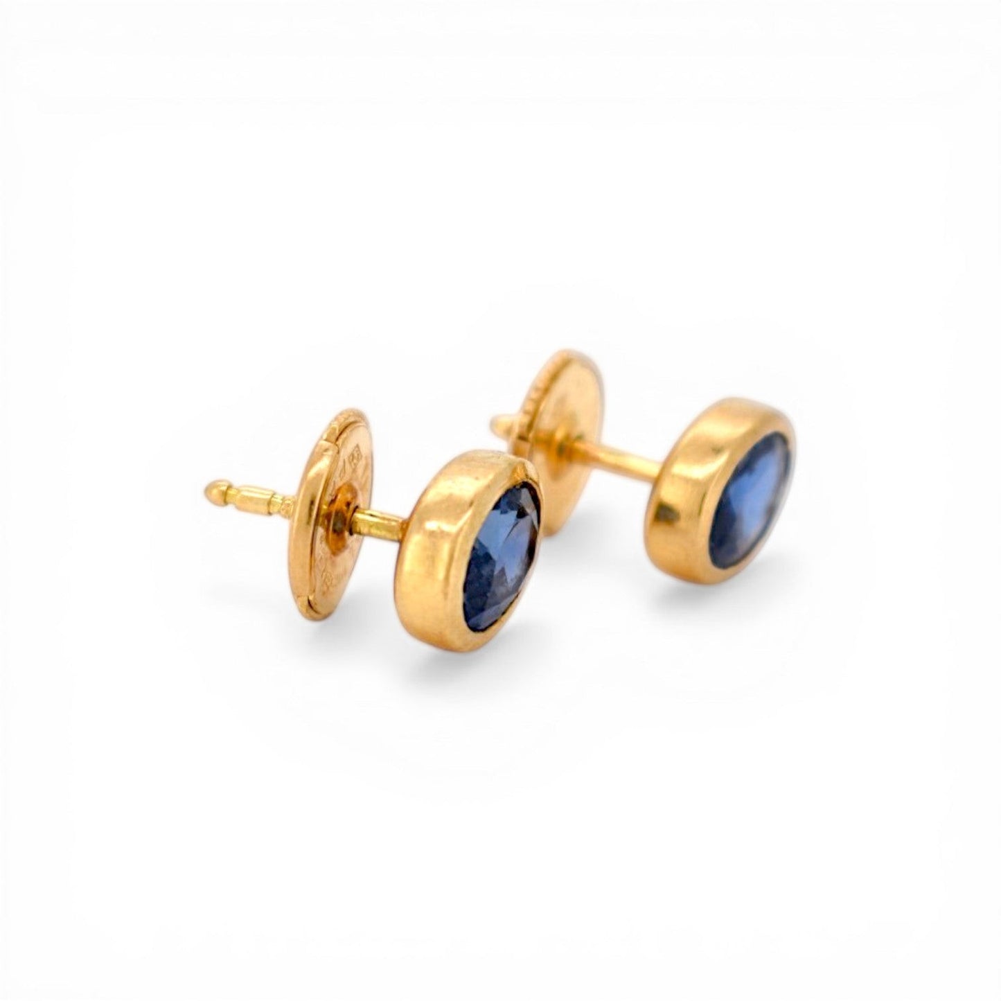 Close-up of the premium Alpa security lock system on 18k gold sapphire earrings