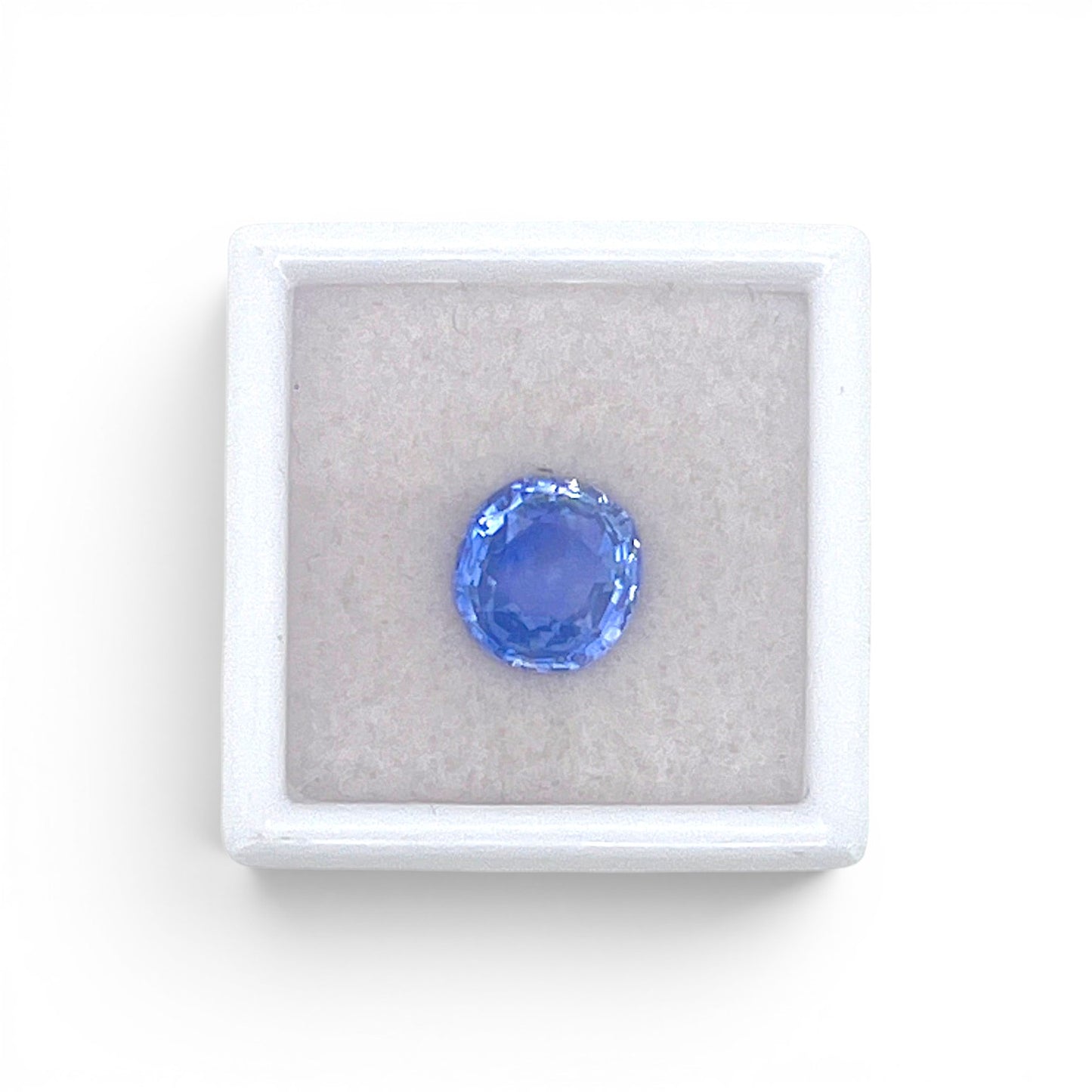 Loose 3.48 carat unheated natural round cushion cut blue sapphire gemstone from Ceylon (Sri Lanka) displayed inside a luxury presentation gem box by Antique Jewelry Finds.