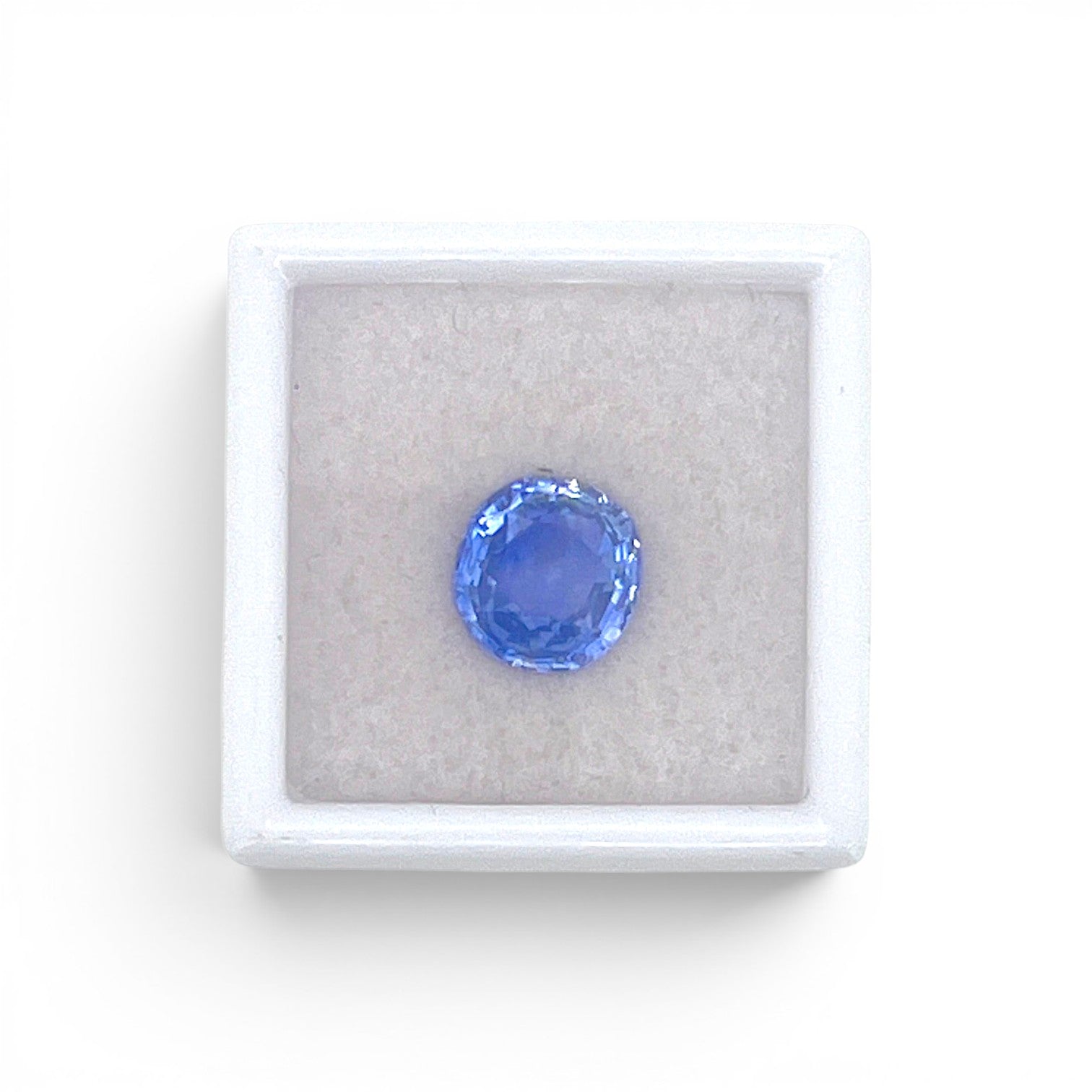 Loose 3.48 carat unheated natural round cushion cut blue sapphire gemstone from Ceylon (Sri Lanka) displayed inside a luxury presentation gem box by Antique Jewelry Finds.