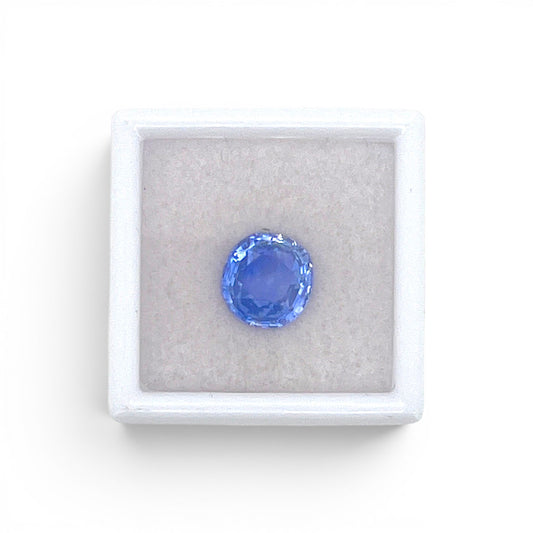 Loose 3.48 carat unheated natural round cushion cut blue sapphire gemstone from Ceylon (Sri Lanka) displayed inside a luxury presentation gem box by Antique Jewelry Finds.