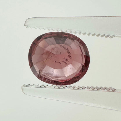 Reverse back view of the natural oval cushion deep pink spinel from Vietnam demonstrating its excellent clarity and lack of treatment.