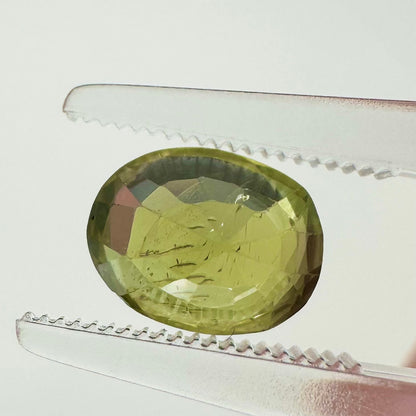 Reverse back view of the natural oval green sapphire from Ceylon demonstrating its excellent clarity, rich undertones, and lack of heat treatment.