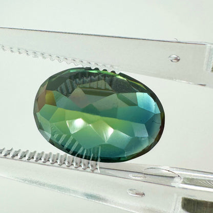 Reverse back view of the natural oval green sapphire demonstrating its excellent clarity, rich earthy tones, and lack of heat treatment.