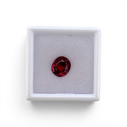 Loose 2.30 carat unheated deep pink spinel gemstone from Vietnam displayed inside a luxury presentation gem box by Antique Jewelry Finds.