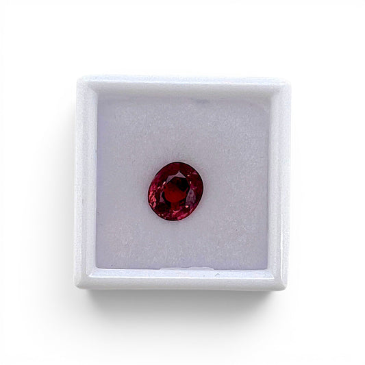 Loose 2.30 carat unheated deep pink spinel gemstone from Vietnam displayed inside a luxury presentation gem box by Antique Jewelry Finds.