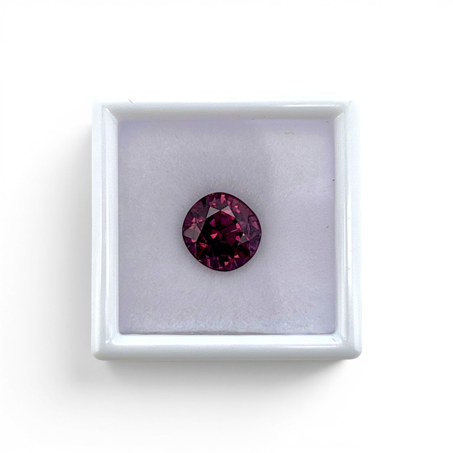 Loose 3.20 carat unheated deep pink spinel gemstone from Vietnam displayed inside a luxury presentation gem box by Antique Jewelry Finds.