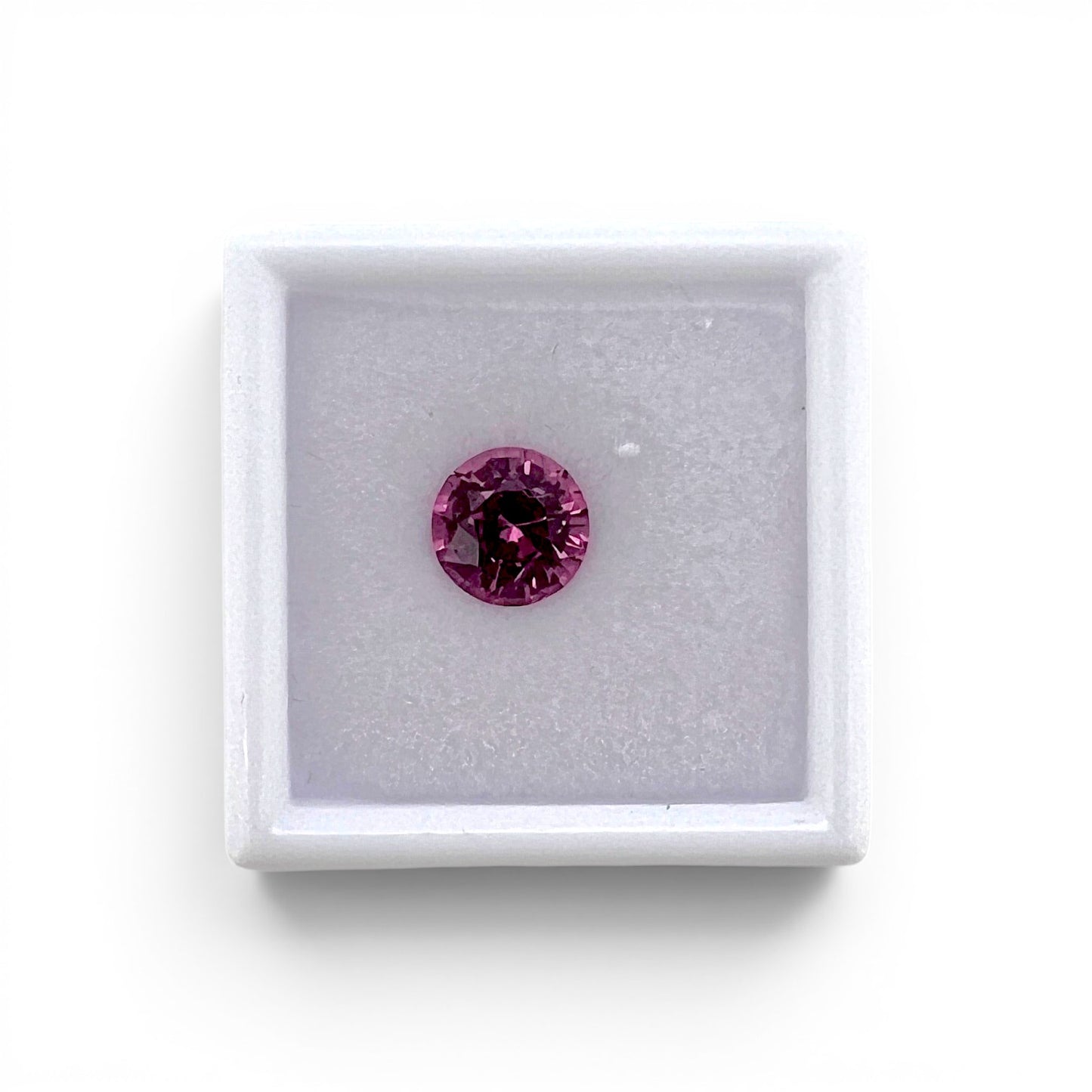 Loose 1.75 carat unheated vivid pink spinel gemstone from Vietnam displayed inside a luxury presentation gem box by Antique Jewelry Finds.