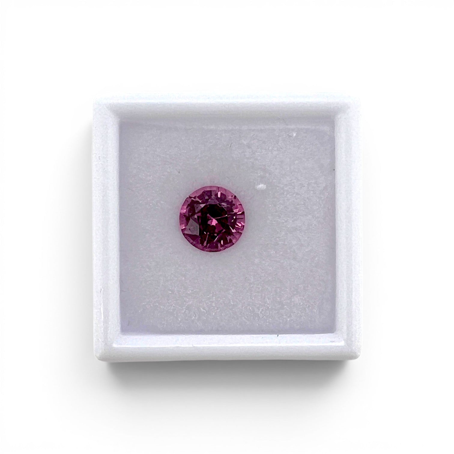 Loose 1.75 carat unheated vivid pink spinel gemstone from Vietnam displayed inside a luxury presentation gem box by Antique Jewelry Finds.