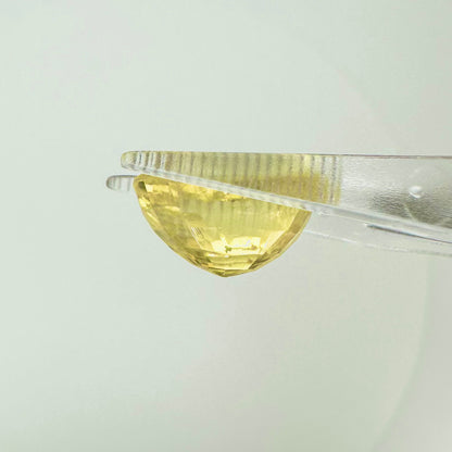 Reverse back view of the natural oval cushion yellow sapphire from Ceylon demonstrating its exceptional clarity, luster, and lack of heat treatment.