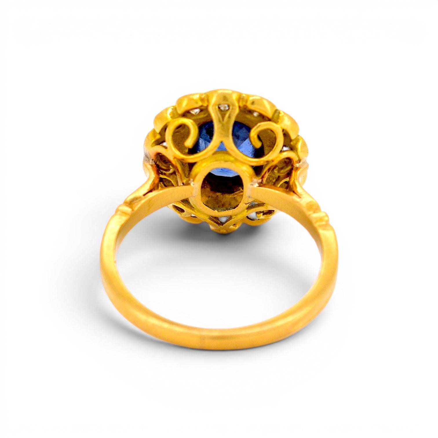 Clear macro photograph of the ring shank showing the official French eagle's head 18k gold hallmark verified by Antique Jewelry Finds.