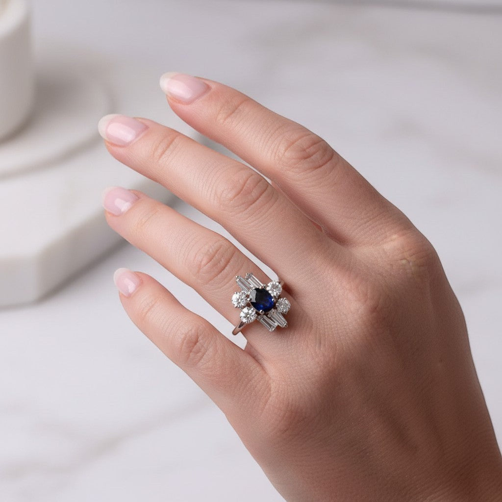 Modernist French 18k white gold sapphire and diamond cocktail ring elegantly worn on a hand, size 6.75 US.