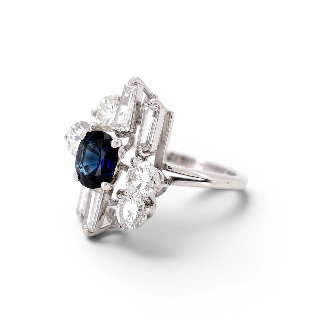 Detailed macro shot of the 1.50 carat natural blue sapphire flanked by exceptional D-color step-cut trapezoid diamonds.