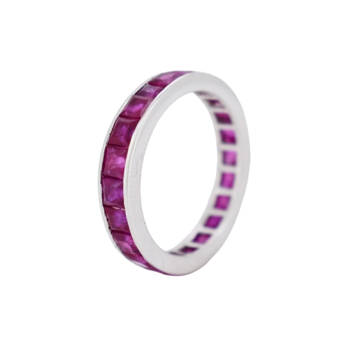 Close-up of the 4mm solid 18k white gold profile of a vintage ruby eternity band
