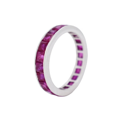 Close-up of the 4mm solid 18k white gold profile of a vintage ruby eternity band