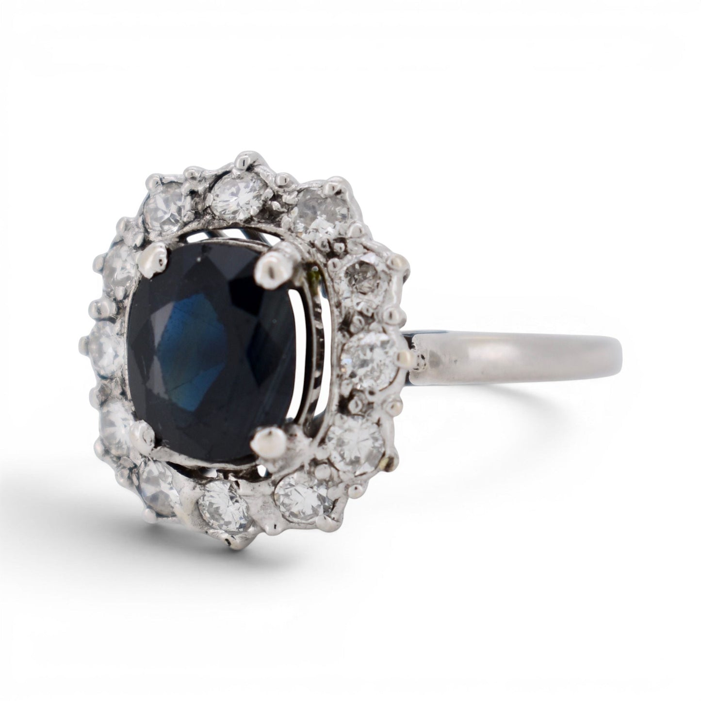 Side view of 18k gold sapphire ring showing the mid-century basket design