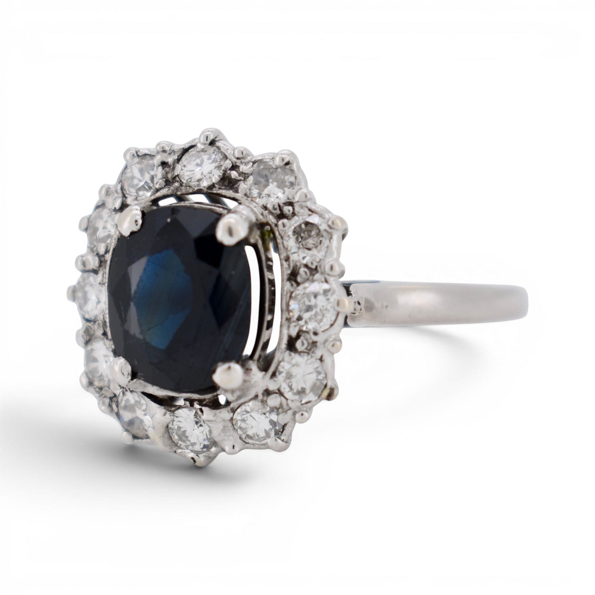 Side view of 18k gold sapphire ring showing the mid-century basket design