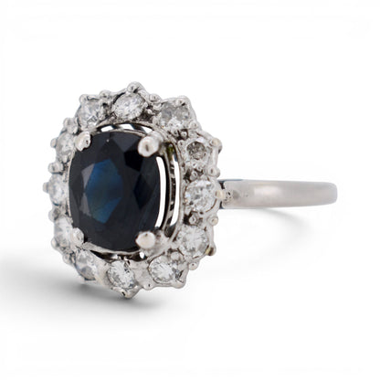 Side view of 18k gold sapphire ring showing the mid-century basket design