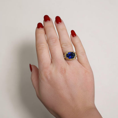 High-end 1950s blue sapphire and diamond statement ring worn elegantly on a hand, size 7 US.