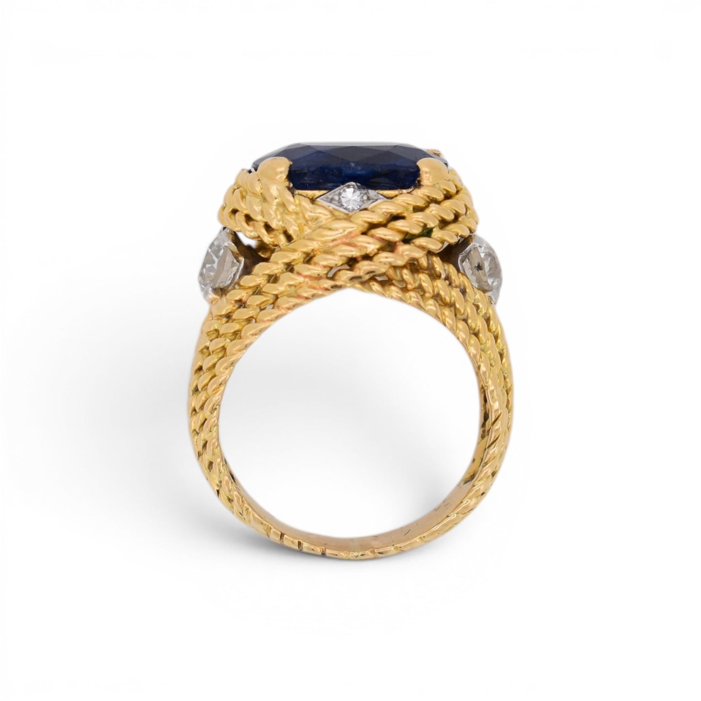 stand view of this statement vintage ring 18k gold braided with natural sapphire and diamonds