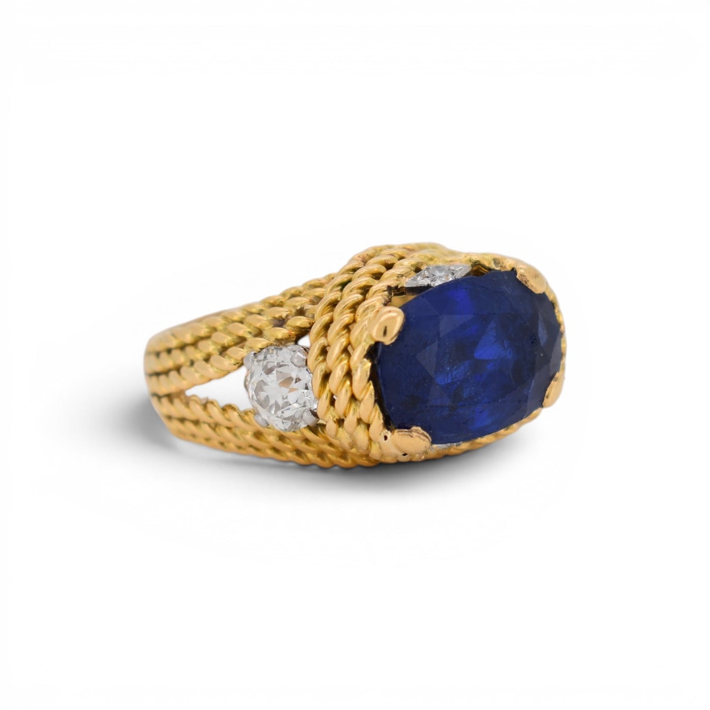 Close-up view of the fine 18k braided gold metalwork and the sparkling 1ctw antique old-cut diamonds.