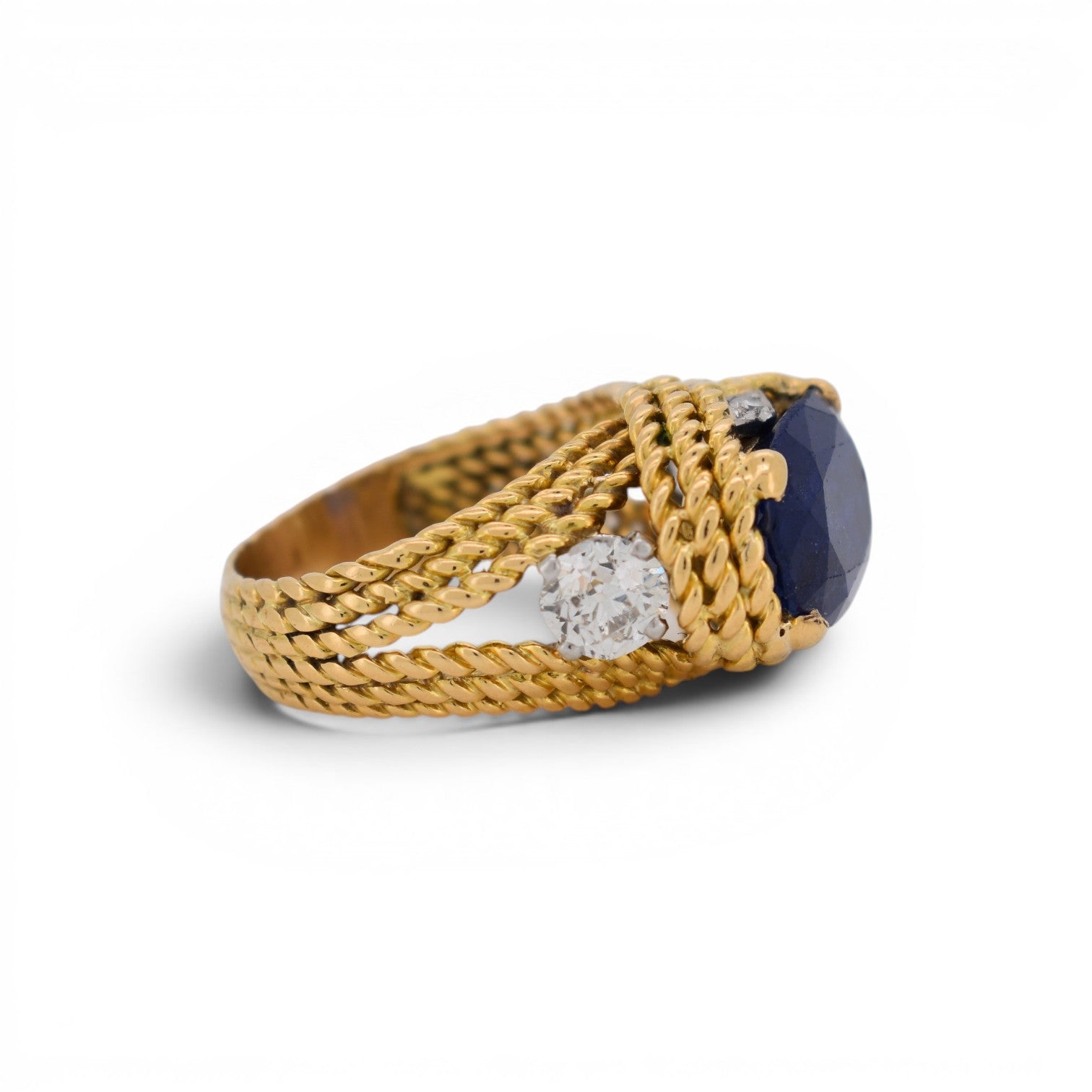 View od old cut diamonds on the right side and the braided 18k gold with side of ceylon blue intense sapphire