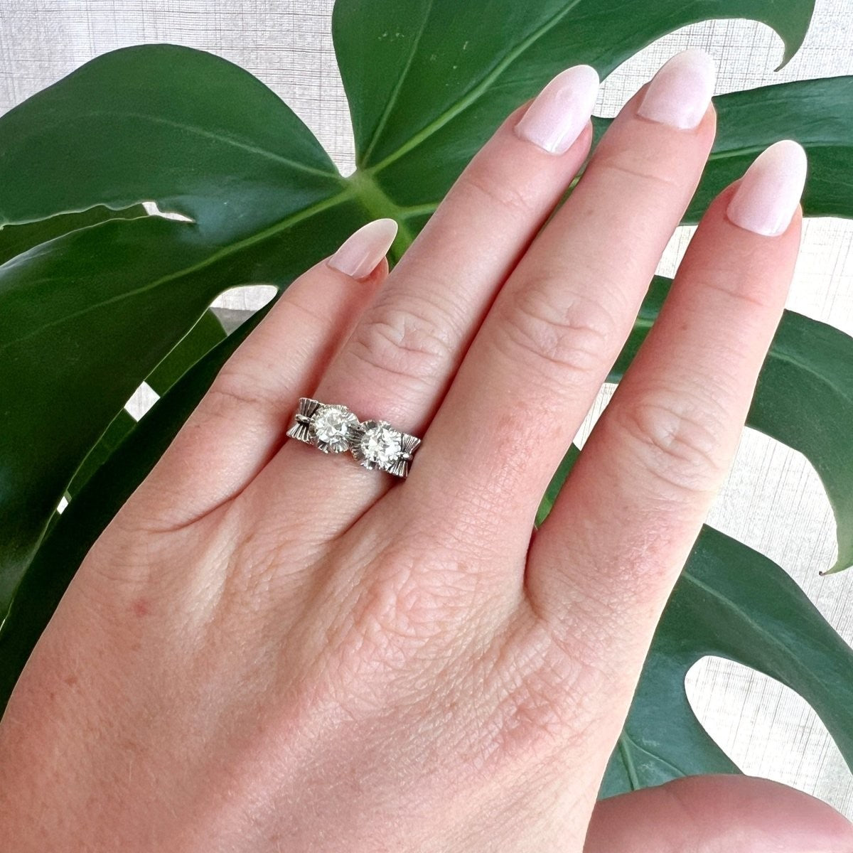 1940s antique diamond bow statement ring worn on a hand for scale